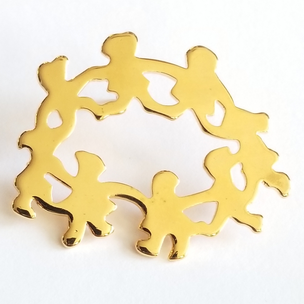 Ring of children holding hands pin gold tone ring around the rosy lapel brooch